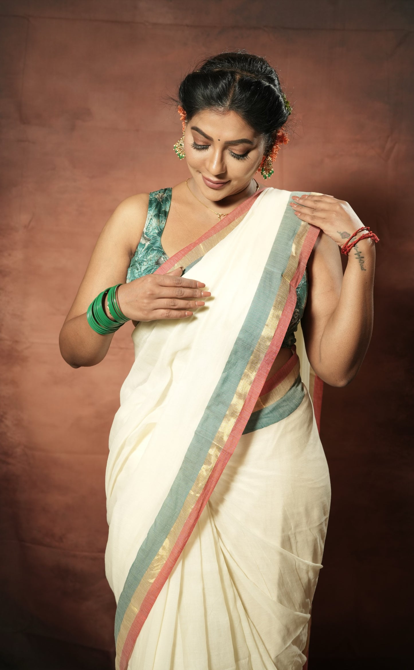 Onam special Mul cotton with red & green Zari